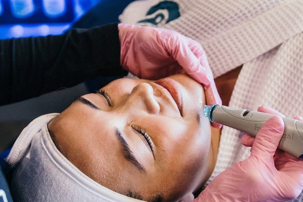 Woman Enjoys Restore Charleston Hydrafacial treatment