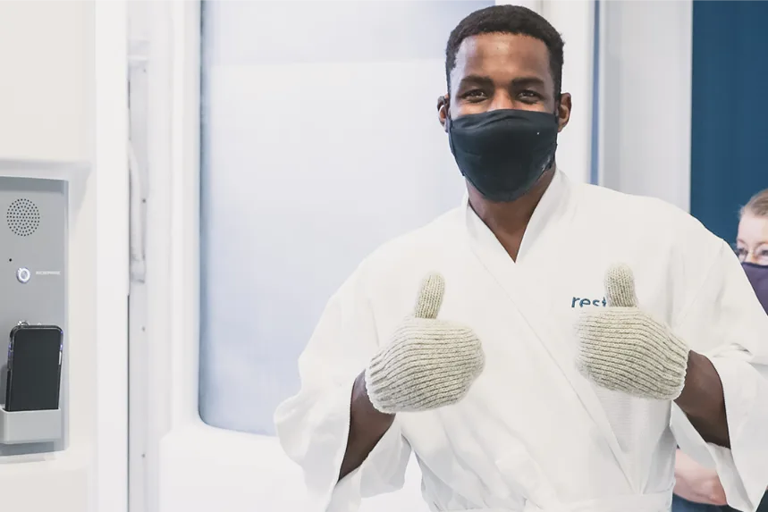 Man with gloves after cryotherapy seeming energized