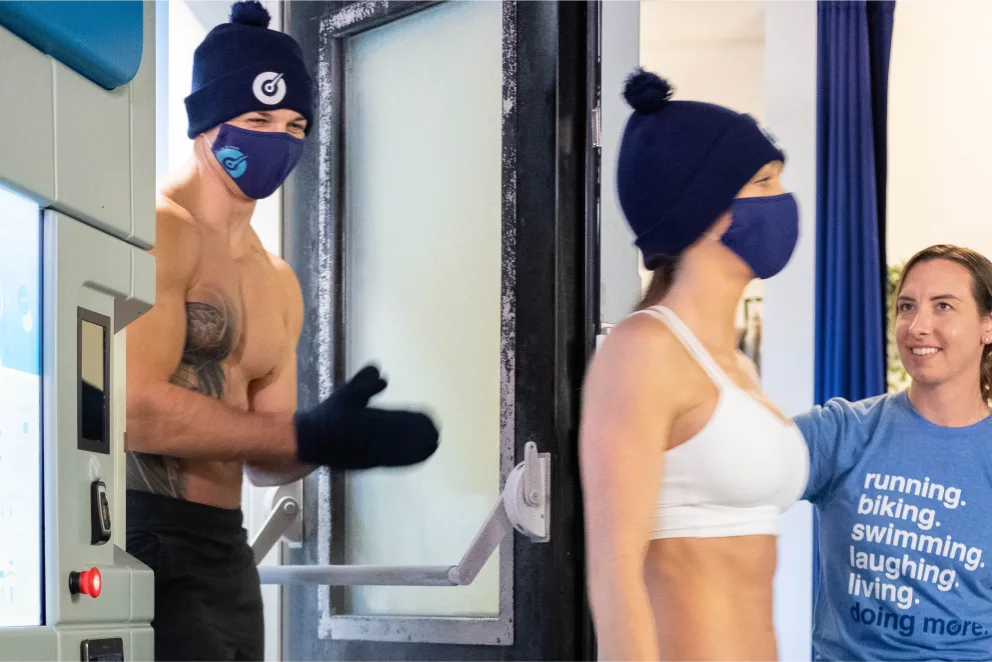 2 Athletes exiting a cryochamber.