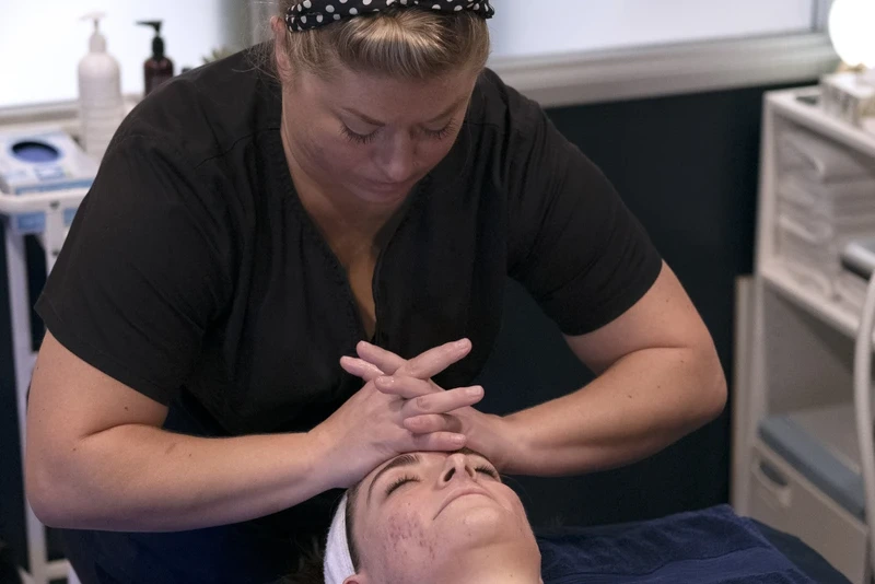 Medical Professional Performs Facial Treatment at Restore South Mt Pleasant